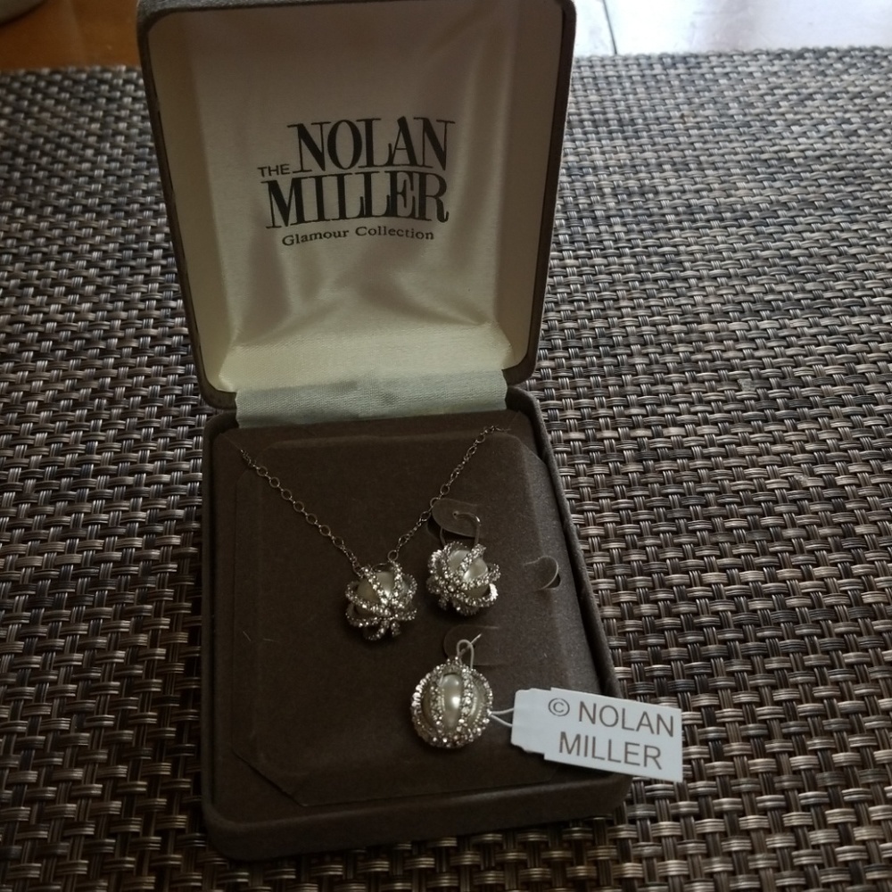 Nolan Miller silver tone necklace and earrings.